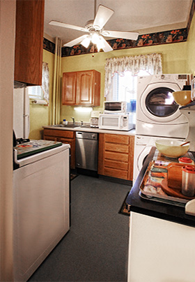 Kitchen with white appliances and blue floor